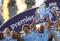 Manchester City's Vincent Kompany lifts the English Premier League trophy after the English Premier League soccer match between Brighton and Manchester City at the AMEX Stadium in Brighton, England, Sunday, May 12, 2019. Manchester City defeated Brighton 4-1 to win the championship. (AP Photo/Frank Augstein)