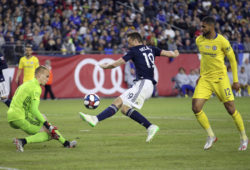 New England Revolution's Antonio Mlinar Delamea, center, clears the ball away as goalkeeper Cody Cropper, left, defends and Chelsea's Ruben Loftus-Cheek (12) pressures on the play during the second half of a friendly soccer match, Wednesday, May 15, 2019, in Foxborough, Mass. (AP Photo/Stew Milne)