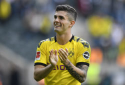 Dortmund's Christian Pulisic says good bye to fans after the German Bundesliga soccer match between Borussia Moenchengladbach and Borussia Dortmund in Moenchengladbach, Germany, Saturday, May 18, 2019. Dortmund finished the season on the second place behind Bayern Munich. (AP Photo/Martin Meissner)