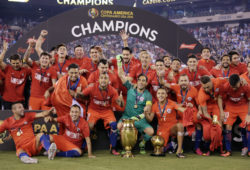 Chile players celebrate with their trophy after the Copa America Centenario championship soccer match, Sunday, June 26, 2016, in East Rutherford, N.J. Chile defeated Argentina 4-2 in penalty kicks to win the championship. (AP Photo/Julie Jacobson)