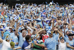 Uruguay supporters cheer for their national team during the group D World Cup soccer match between Italy and Uruguay at the Arena das Dunas in Natal, Brazil, Tuesday, June 24, 2014. (AP Photo/Petr David Josek)