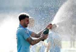 FILE PHOTO: Soccer Football - Premier League - Brighton & Hove Albion v Manchester City - The American Express Community Stadium, Brighton, Britain - May 12, 2019  Manchester City's Kyle Walker sprays sparkling wine as he celebrates winning the Premier League           Action Images via Reuters/John Sibley  EDITORIAL USE ONLY. No use with unauthorized audio, video, data, fixture lists, club/league logos or "live" services. Online in-match use limited to 75 images, no video emulation. No use in betting, games or single club/league/player publications.  Please contact your account representative for further details/File Photo  X03811