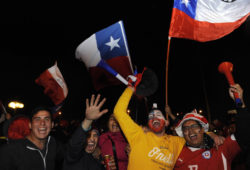 Fans of Chile's national soccer team celebrate their team's victory over Peru during the Copa America semifinal soccer match, in Santiago, Chile, Monday, June 29, 2015. Chile won the match 2-1. (AP Photo/Victor Ruiz)