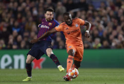 Barcelona forward Lionel Messi, left, fights for the ball with Lyon midfielder Tanguy Ndombele during the Champions League round of 16, 2nd leg, soccer match between FC Barcelona and Olympique Lyon at the Camp Nou stadium in Barcelona, Spain, Wednesday, March 13, 2019. (AP Photo/Manu Fernandez)