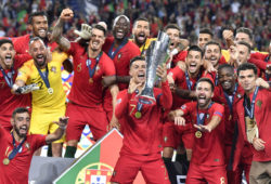 Portugal's Cristiano Ronaldo lifts up the trophy as he celebrates with players after winning the UEFA Nations League final soccer match between Portugal and Netherlands at the Dragao stadium in Porto, Portugal, Sunday, June 9, 2019. Portugal won 1-0. (AP Photo/Martin Meissner)