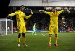 Liverpool's Daniel Sturridge, left, celebrates scoring his side's first goal with Alberto Moreno during the English FA Cup fifth round soccer match between Crystal Palace and Liverpool at Selhurst Park stadium in London, Saturday, Feb. 14, 2015.  (AP Photo/Matt Dunham)