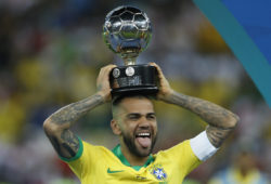 Brazil's Dani Alves celebrates with the trophy for best player of the tournament after Brazil's 3-1 victory over Peru in the final soccer match of the Copa America at the Maracana stadium in Rio de Janeiro, Brazil, Sunday, July 7, 2019. (AP Photo/Victor R. Caivano)