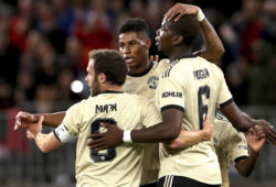 Manchester United's Marcus Rashford, centre, is congratulated by teammates Juan Mata, left, and Paul Pogba after scoring a goal against the Perth Glory during their friendly soccer match in Perth, Australia, Saturday, July 13, 2019. (Richard Wainwright/AAP Image via AP)