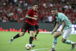 Manchester United's Victor Lindelof, left, in action during the International Champions Cup soccer match between Manchester United and Milan in Singapore, Saturday, July 20, 2019. (AP Photo/Danial Hakim)