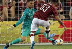Bayern Munich goalkeeper Sven Ulreich, left, stops a shot by Milan forward Patrick Cutrone (63) during the second half of an International Champions Cup soccer match in Kansas City, Kan., Tuesday, July 23, 2019. FC Bayern defeated AC Milan 1-0. (AP Photo/Orlin Wagner)