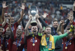 Liverpool's team captain Jordan Henderson lifted the trophy after winning the UEFA Super Cup soccer match between Liverpool and Chelsea, in Besiktas Park, in Istanbul, Thursday, Aug. 15, 2019. Liverpool won 5-4 in a penalty shootout after the game ended tied 2-2. (AP Photo/Thanassis Stavrakis)