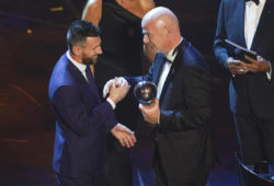 September 23, 2019: MILAN, ITALY - SEPTEMBER 23: FIFA President Gianni Infantiono hands out the trophy to Lionel Messi from FC Barcelona during The Best FIFA Football Awards 2019 at the Teatro alla Scala, on September 23, 2019 in Milan, Italy.