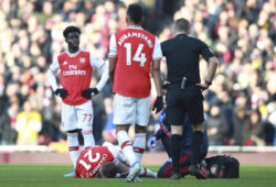 Arsenal's Calum Chambers lies injured on the pitch during the English Premier League soccer match between Arsenal and Chelsea, at the Emirates Stadium in London, Sunday, Dec. 29, 2019. (AP Photo/Ian Walton)  XIW111