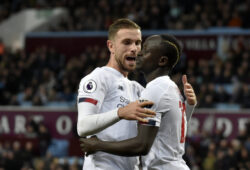 Liverpool's Sadio Mane, right, celebrates with Liverpool's Jordan Henderson after scoring his side's second goal during the English Premier League soccer match between Aston Villa and Liverpool at Villa Park in Birmingham, England, Saturday, Nov. 2, 2019. (AP Photo/Rui Vieira)  XDMV113