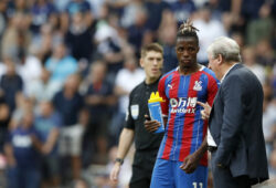 Crystal Palace's manager Roy Hodgson, right, gives instructions to Crystal Palace's Wilfried Zaha during their English Premier League soccer match between Tottenham Hotspur and Crystal Palace at White Hart Lane stadium in London, Saturday, Sept. 14, 2019. (AP Photo/Alastair Grant)  XDMV147