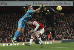 Arsenal's goalkeeper Bernd Leno, left, clears the ball in front Manchester City's Raheem Sterling during the English Premier League soccer match between Arsenal and Manchester City, at the Emirates Stadium in London, Sunday, Dec. 15, 2019. (AP Photo/Ian Walton)  HAS139