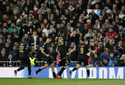 Manchester City's Kevin De Bruyne celebrates with teammates after scores his side's second goal from the penalty spot during the Champions League, round of 16, first leg soccer match between Real Madrid and Manchester City at the Santiago Bernabeu stadium in Madrid, Spain, Wednesday, Feb. 26, 2020. (AP Photo/Manu Fernandez)  XDMV153