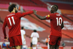 Soccer Football - Premier League - Liverpool v Crystal Palace - Anfield, Liverpool, Britain - June 24, 2020  Liverpool's Sadio Mane celebrates scoring their fourth goal with Mohamed Salah, as play resumes behind closed doors following the outbreak of the coronavirus disease (COVID-19) REUTERS / Phil Noble / Pool  EDITORIAL USE ONLY. No use with unauthorized audio, video, data, fixture lists, club/league logos or "live" services. Online in-match use limited to 75 images, no video emulation. No use in betting, games or single club/league/player publications.  Please contact your account representative for further details.  X01988