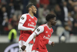 Arsenal's Pierre-Emerick Aubameyang, left, celebrates with Arsenal's Bukayo Saka after scoring his side's third goal during the Europa League Group F soccer match between Eintracht Frankfurt and Arsenal in the Commerzbank Arena in Frankfurt, Germany, Thursday, Sept. 19, 2019. (AP Photo/Michael Probst)  HAS136