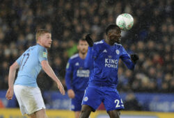 Leicester City's Wilfred Ndidi, right heads the ball towards goal watched by Manchester City's Kevin De Bruyne during the English League Cup quarterfinal soccer match at the King Power stadium in Leicester, England, Tuesday, Dec.18, 2018. (AP Photo/Rui Vieira)