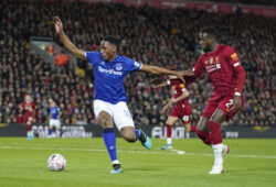 Everton's Yerry Mina, left, challenges for the ball with Liverpool's Divock Origi during the English FA Cup third round soccer match between Liverpool and Everton at Anfield stadium in Liverpool, England, Sunday, Jan. 5, 2020. (AP Photo/Jon Super)  XAC149
