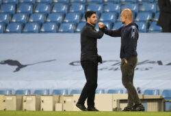 Arsenal's head coach Mikel Arteta, left, greets Manchester City's head coach Pep Guardiola after the English Premier League soccer match between Manchester City and Arsenal at the Etihad Stadium in Manchester, England, Wednesday, June 17, 2020. Manchester City won the match 3-0. The English Premier League resumes Wednesday after its three-month suspension because of the coronavirus outbreak. (Peter Powell/Pool via AP)  TH196