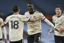 Manchester United's Paul Pogba celebrates with teammate Bruno Fernandes, left, after scoring his team's third goal during the English Premier League soccer match between Aston Villa and Manchester United at Villa Park in Birmingham, England, Thursday, July 9, 2020. (AP Photo/Shaun Botterill,Pool)  XMB161