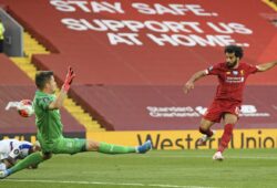 Liverpool's Mohamed Salah scores his side's second goal during the English Premier League soccer match between Liverpool and Crystal Palace at Anfield Stadium in Liverpool, England, Wednesday, June 24, 2020. LPChamp (Shaun Botterill/Pool via AP) TH141