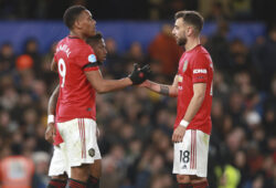 Manchester United's Anthony Martial, left, is congratulated by teammate Bruno Fernandes after scoring a goal during the English Premier League soccer match between Chelsea and Manchester United at Stamford Bridge in London, England, Monday, Feb. 17, 2020. (AP Photo/Ian Walton)  XMB117