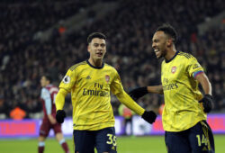 Arsenal's Pierre-Emerick Aubameyang, right, celebrates with Arsenal's Gabriel Martinelli after scoring his side's third goal duels for the ball with during the English Premier League soccer match between West Ham Utd and Arsenal at the London Stadium in London, Monday, Dec. 9, 2019. (AP Photo/Kirsty Wigglesworth)  XDMV147