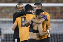 epa08588624 Wolves manager Nuno Espirito Santo (L) hugs his player Raul Jimenez (2-L) after the UEFA Europa League Round of 16 second leg match between Wolverhampton Wanderers and Olympiacos in Wolverhampton, Britain, 06 August 2020.  EPA-EFE/PETER POWELL