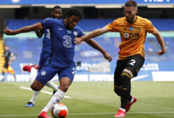 Wolverhampton Wanderers' Matt Doherty, right, challenges Chelsea's Reece James during the English Premier League soccer match between Chelsea and Wolverhampton Wanderers at Stamford Bridge, in London, Sunday July 26, 2020. (Matthew Childs/Pool via AP)  PJO115