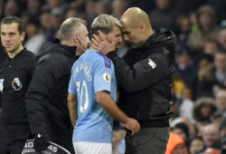 Manchester City's head coach Pep Guardiola, right, talks with Sergio Aguero as he is substituted after getting injured during the English Premier League soccer match between Manchester City and Chelsea at Etihad stadium in Manchester, England, Saturday, Nov. 23, 2019. (AP Photo/Rui Vieira)  XAF128