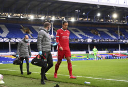 Liverpool's Virgil van Dijk leaves the match with an injury during the English Premier League soccer match between Everton and Liverpool at Goodison Park stadium, in Liverpool, England, Saturday, Oct. 17, 2020. (Laurence Griffiths/Pool via AP)  LMD117