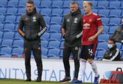 Manchester United's Donny van der Beek, right speaks to Manchester United's manager Ole Gunnar Solskjaer, center as he prepares to come on as a substitute during the English Premier League soccer match between Brighton Hove Albion and Manchester United in Brighton, England, Saturday, Sept. 26, 2020. (John Sibley/Pool via AP)  XAG151