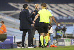 Manchester City's head coach Pep Guardiola, center, argues with Porto's head coach Sergio Conceicao, left, during the Champions League group C soccer match between Manchester City and FC Porto at the Etihad stadium in Manchester, England, Wednesday, Oct. 21, 2020. (Martin Rickett/Pool via AP)  HAS127