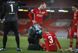 Liverpool's Fabinho gets medical assistance for an injury during the Champions League Group D soccer match between Liverpool and FC Midtjylland at Anfield stadium, in Liverpool, England, Tuesday, Oct. 27, 2020. (Phil Noble/Pool via AP)  PDJ140