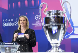 British soccer player Kelly Smith shows a ticket of Italy's soccer club Atalanta BC during the UEFA Champions League 2019/20 round of 16 draw at the UEFA Headquarters in Nyon, Switzerland, Monday, Dec. 16, 2019. (Laurent Gillieron/Keystone via AP)  KSOB140