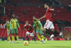Manchester United's Bruno Fernandes, right, scores the opening goal from the penalty spot during the English Premier League soccer match between Manchester United and West Bromwich Albion at the Old Trafford stadium in Manchester, England, Saturday, Nov. 21, 2020. (Alex Livesey/Pool via AP)  XPAG130