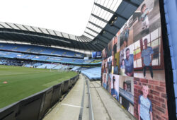 Photos of fans are shown on displays inside the stadium before the English Premier League soccer match between Manchester City and Norwich City at the Etihad Stadium in Manchester, England, Sunday, July 26, 2020. (Peter Powelll/Pool via AP)  XVG113